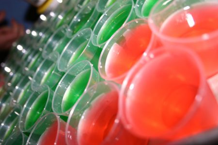 Image: rows of brightly colored Jell-o shots
