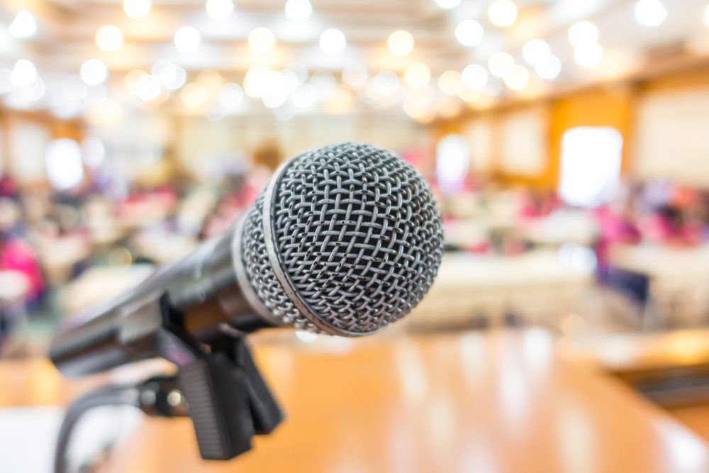 Image: microphone at front of conference room