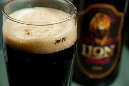 Image: pint glass full of Lion stout