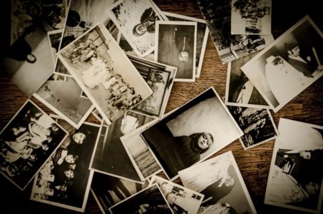 Image: old photos scattered around a table