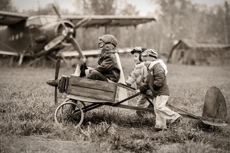 Image: little boys trying to launch homemade plane