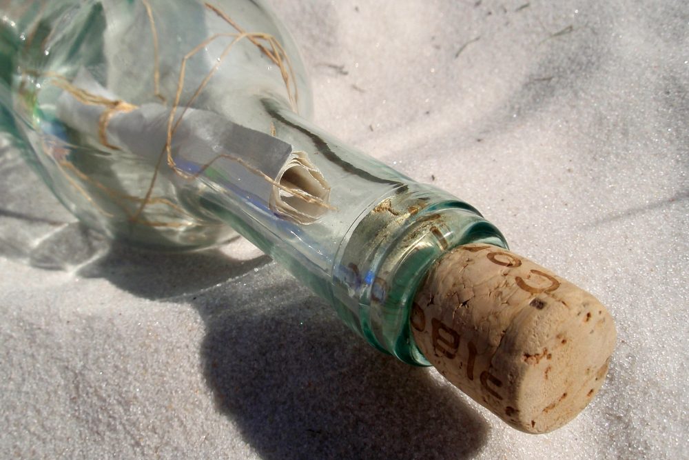 Message inside a glass bottle washed up on the beach