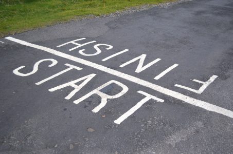 Image: start-finish line painted on a road for a foot race