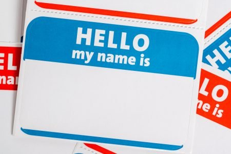 Image: blank name tag labeled "Hello my name is."