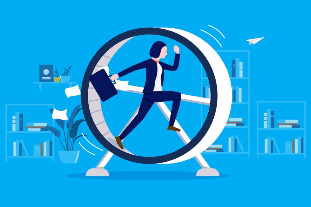 Image: illustration of a businesswoman running on a large hamster wheel, in front of bookcases.