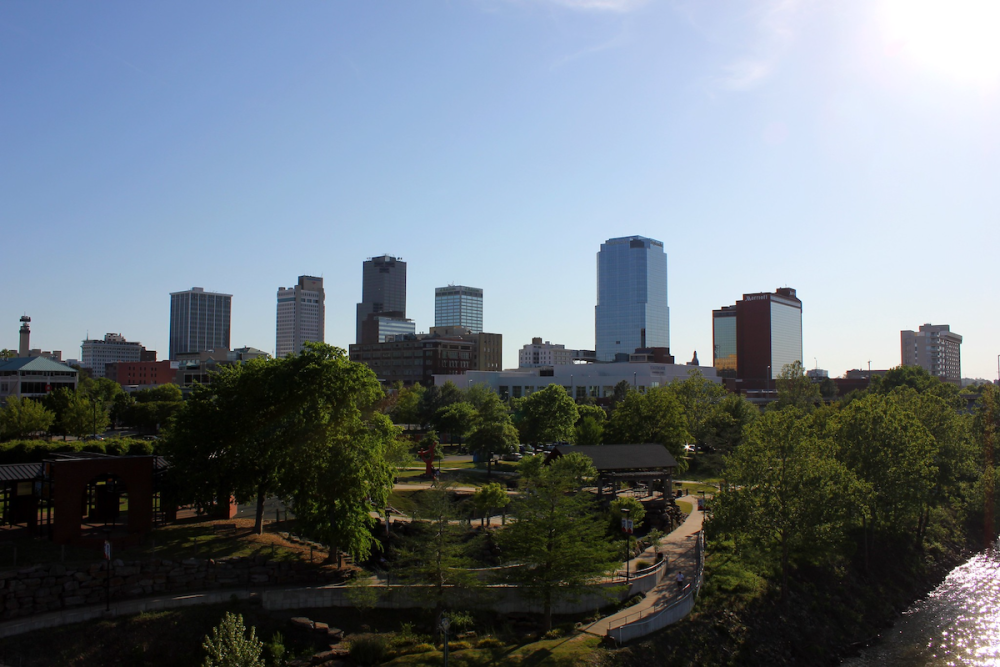 Image: a photo of downtown Little Rock, Arkansas with a park in the foreground.